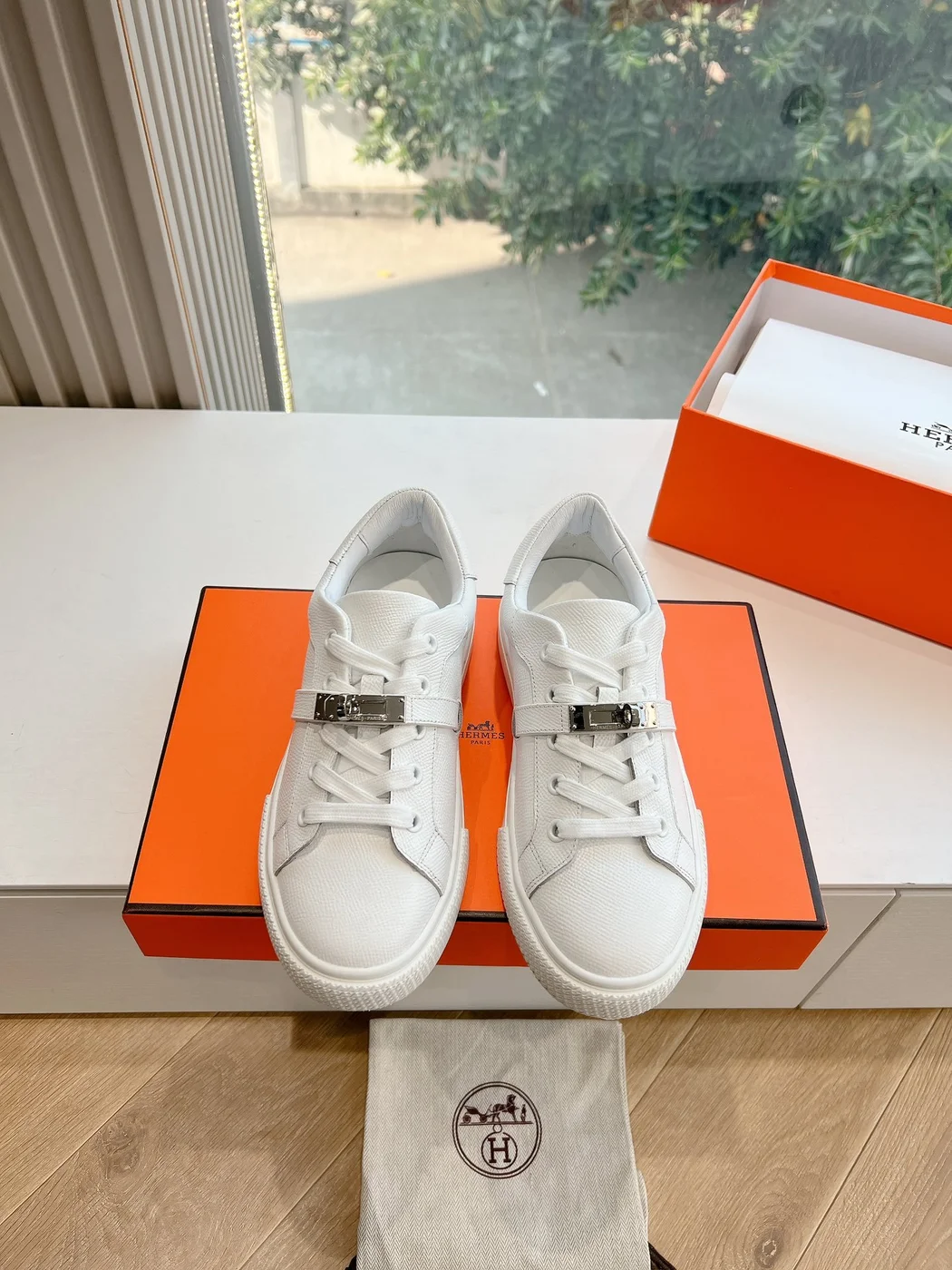 Hermès Women White Low-Top Sneakers — Silver-Tone Buckle Detail product view 1