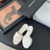 Chanel Women Ivory Quilted Leather Mules — Chain-Woven CC Detail product view 4