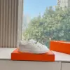 Hermès Women White Low-Top Sneakers — Silver-Tone Buckle Detail product view 2