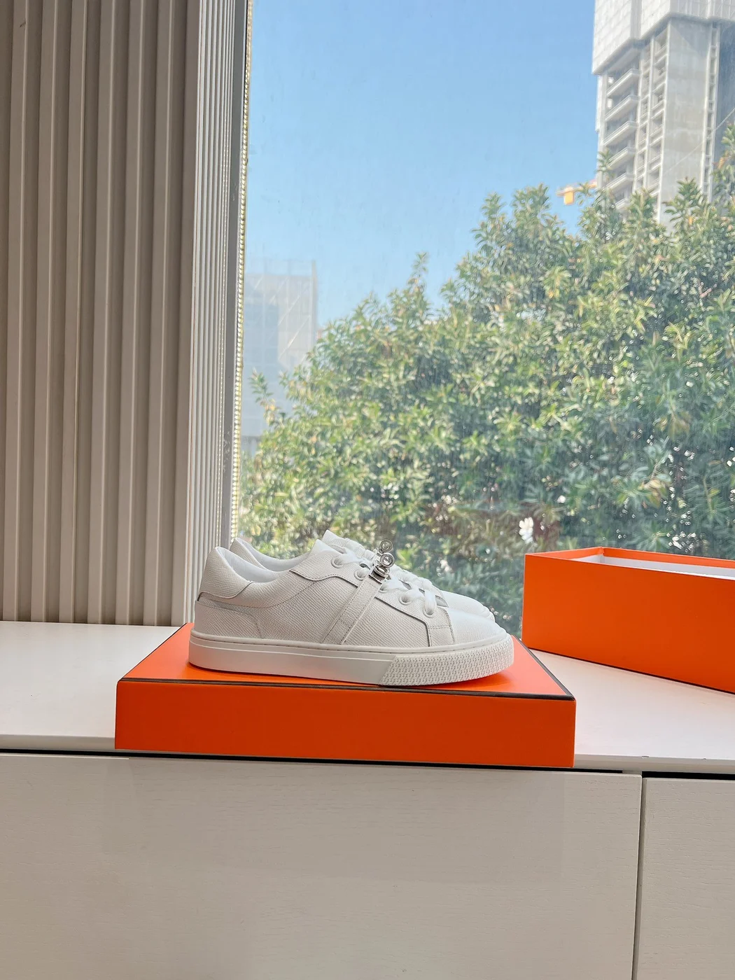 Hermès Women White Low-Top Sneakers — Silver-Tone Buckle Detail product view 2