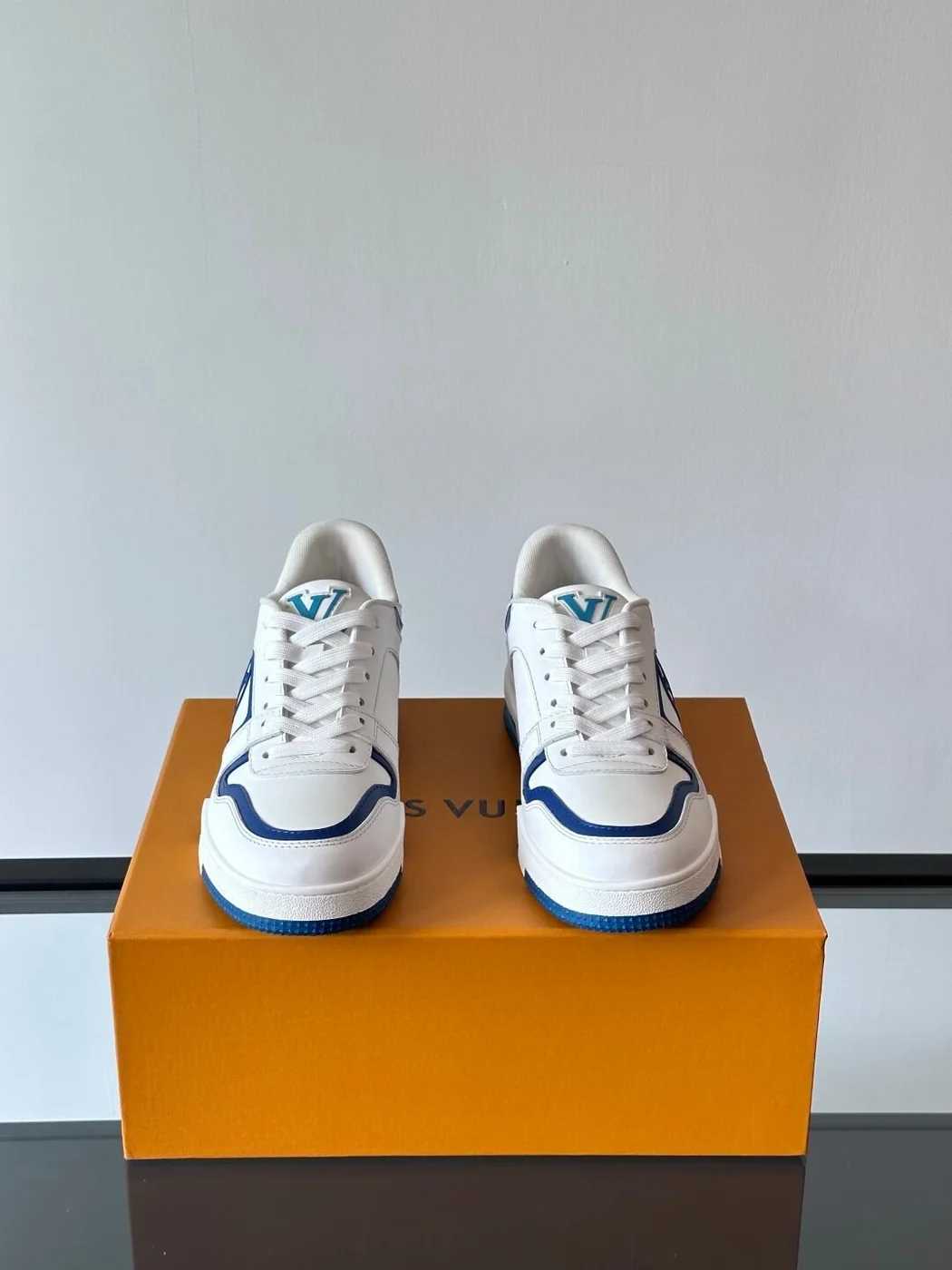 Louis Vuitton Men White and Blue Sneakers — Oval LV Side Detail product view 2