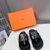 Hermès Women Black Leather Sandals — Gold-Tone Buckle Slides product view 1