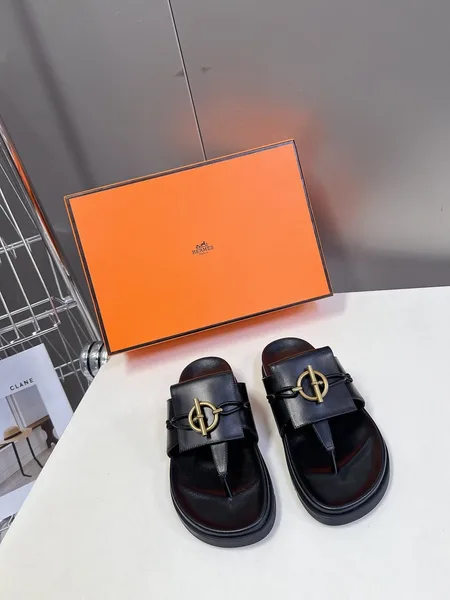 Hermès Women Black Leather Sandals — Gold-Tone Buckle Slides product photo