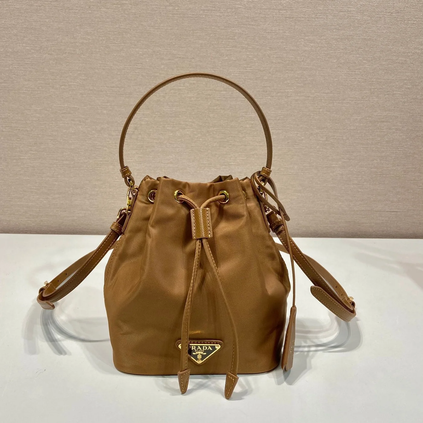 Prada Bucket Bag 19 In Russet Brown Re-Nylon And Calfskin Handle product view 1