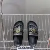 Hermès Women Black Leather Sandals — Gold-Tone Buckle Slides product view 2