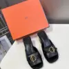 Hermès Women Black Leather Mules — Gold-Tone Buckle Open-Toe Style product view 1