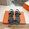 Hermès Women Black Leather Sandals — Two-Strap Metal-Bar Detail product view 1