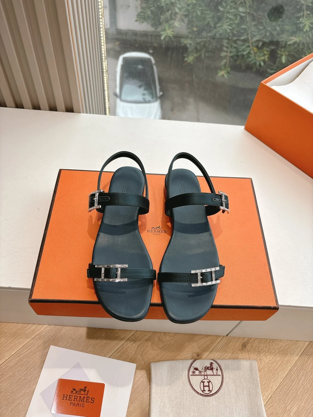 Hermès Women Black Leather Sandals — Two-Strap Metal-Bar Detail product view 1