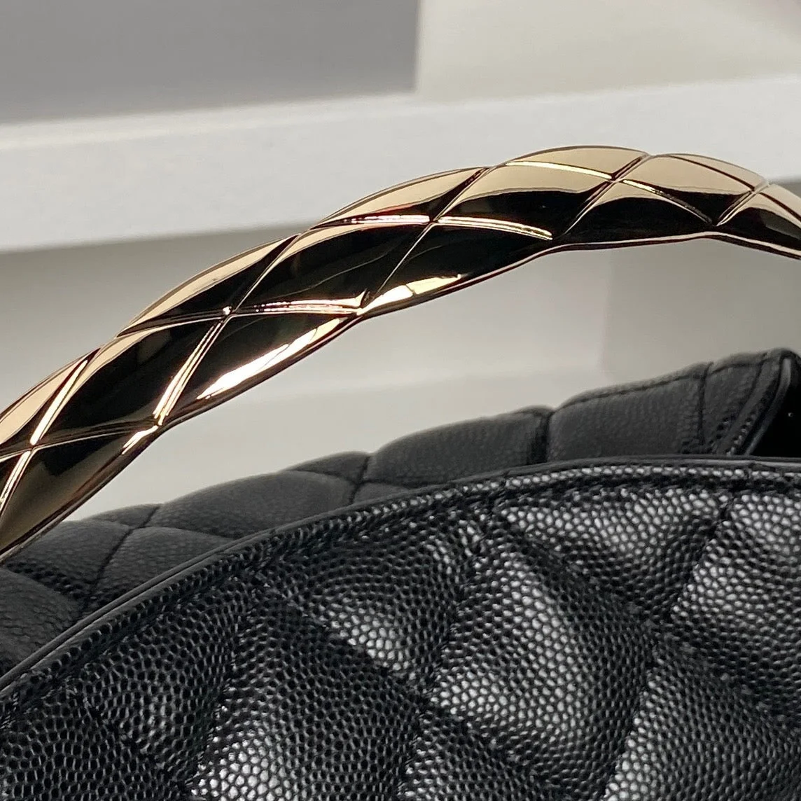 Chanel 24A Hobo Handbag in black quilted caviar leather product view 6