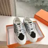 Hermès Women Black Blue Canvas And Leather Sneakers product view 1