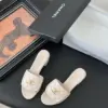 Chanel Women Ivory Quilted Leather Mules — Chain-Woven CC Detail product view 5