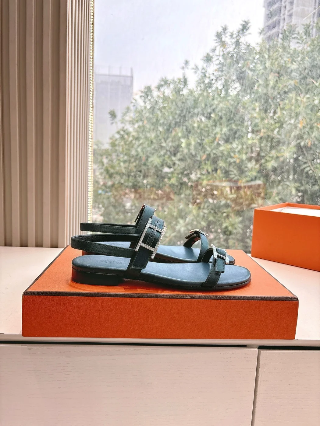 Hermès Women Black Leather Sandals — Two-Strap Metal-Bar Detail product view 2