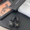 Chanel Women Black Quilted Leather Slides — Chain-Woven CC Detail product view 1