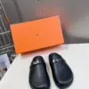 Hermès Women Black Leather Mules — Rounded Toe with Black Sole product view 1