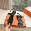 Hermès Women Black Leather Sandals — Two-Strap Metal-Bar Detail product view 5
