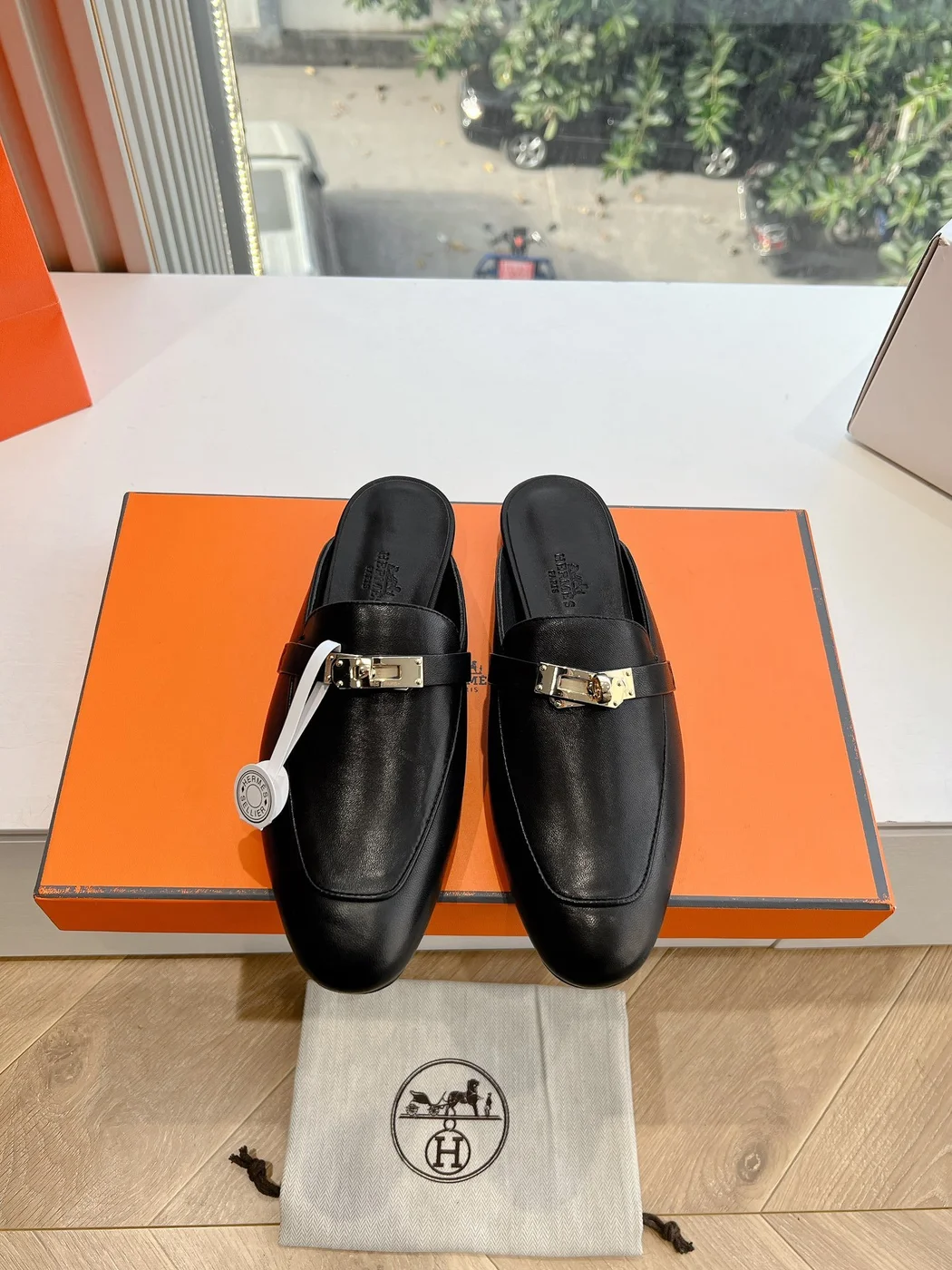 Hermès Women Black Leather Mules — Metal-Bar Loafer Style product view 1