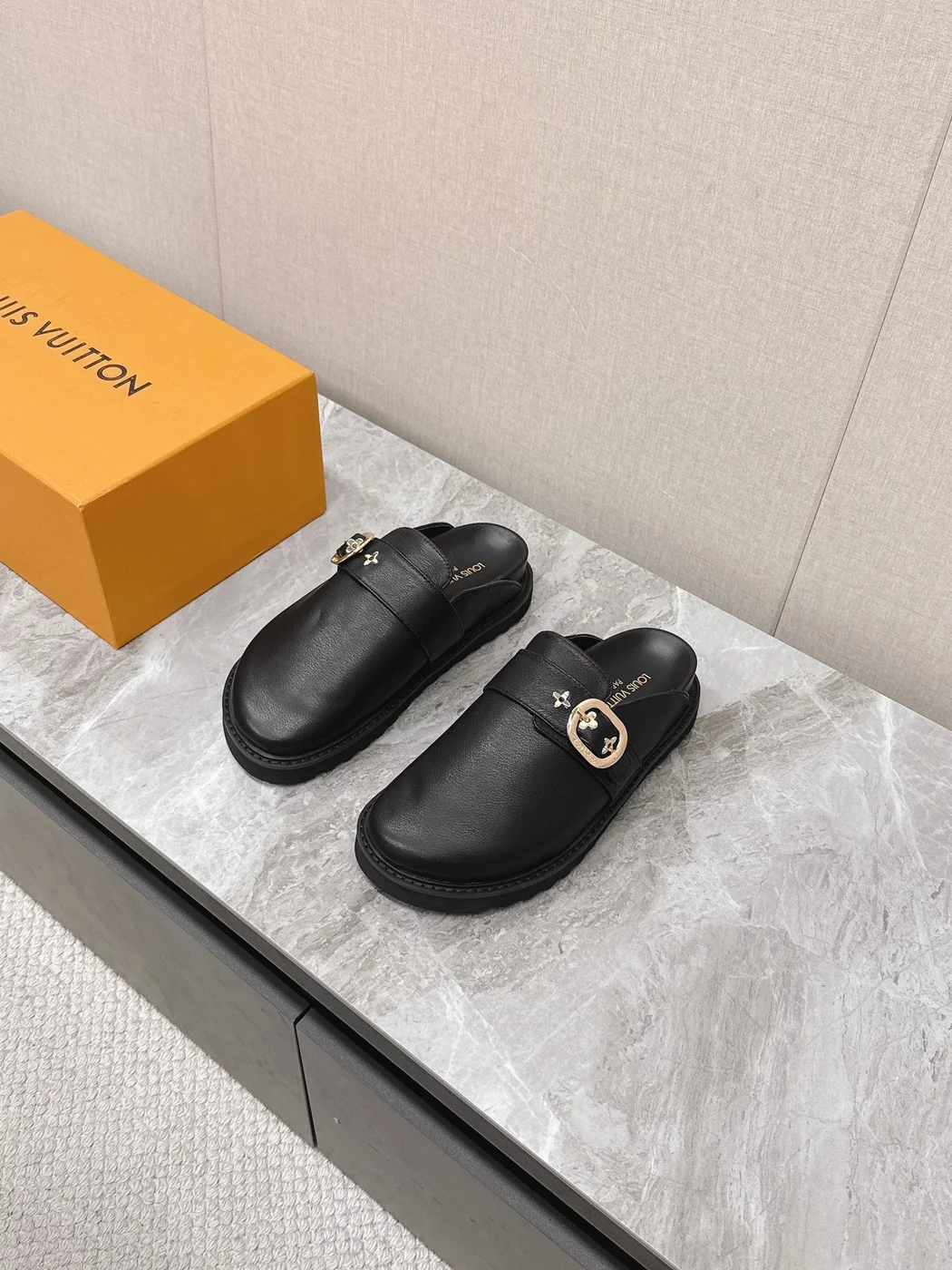 Louis Vuitton Women Black Leather Mules — Round Gold-Tone Buckle Detail product view 1