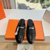 Hermès Women Black Leather Mules — Textured Loafer Style product view 1