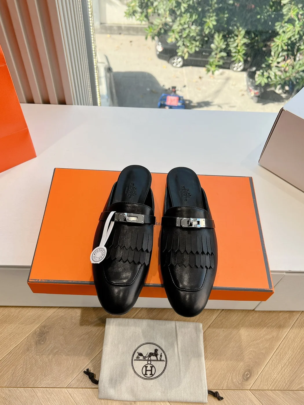 Hermès Women Black Leather Mules — Textured Loafer Style product view 1