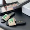Chanel Women Beige Fabric Green Logo Slides product view 2