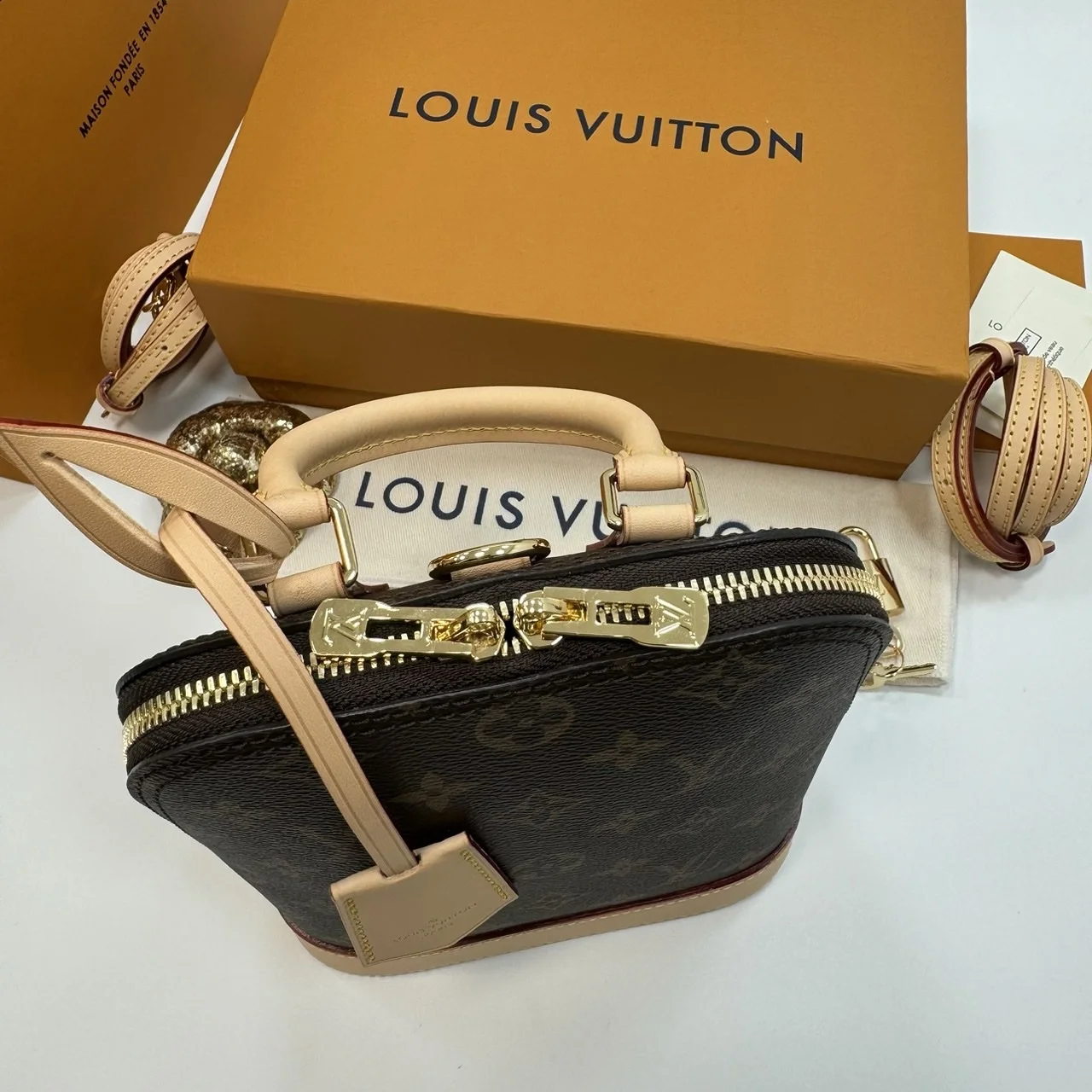 Louis Vuitton Alma backpack in the signature brown monogram canvas product view 4