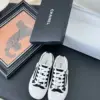 Chanel Women Black Canvas White Trim Sneakers product view 1