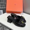 Hermès Women Black Leather Mules — Gold-Tone Buckle Open-Toe Style product view 3