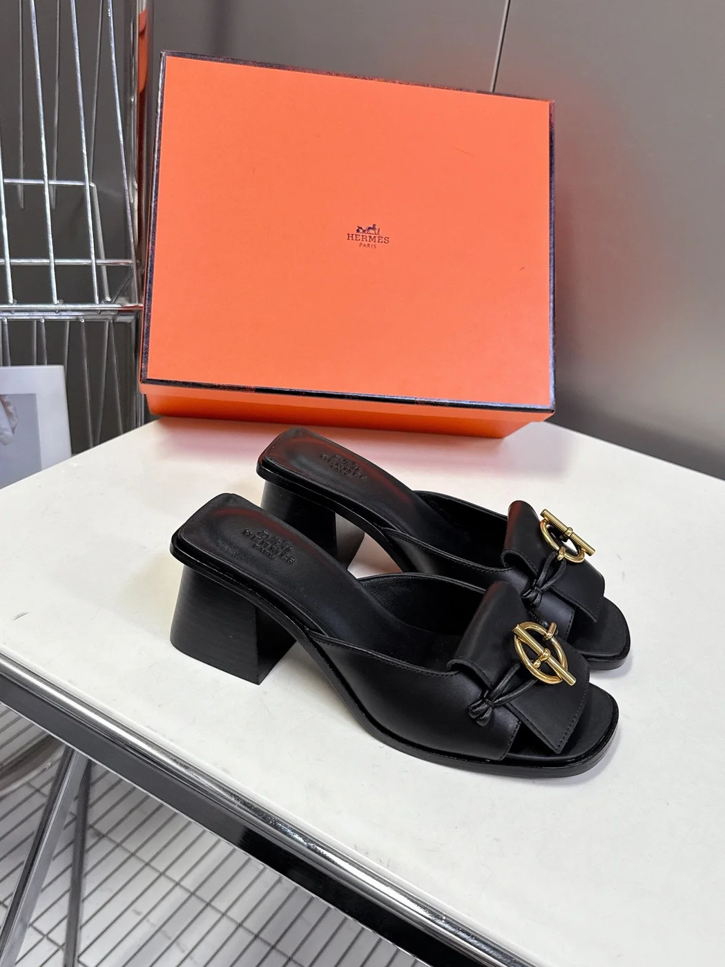Hermès Women Black Leather Mules — Gold-Tone Buckle Open-Toe Style product view 3