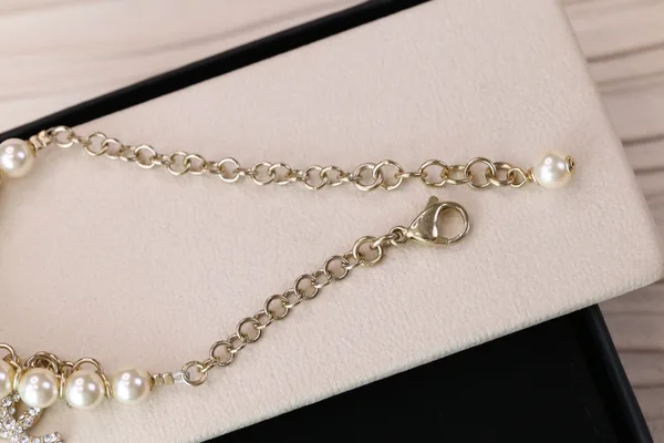 Chanel Bird CC Pearl-Effect Tassel Charm Bracelet Gold-Tone product view 9