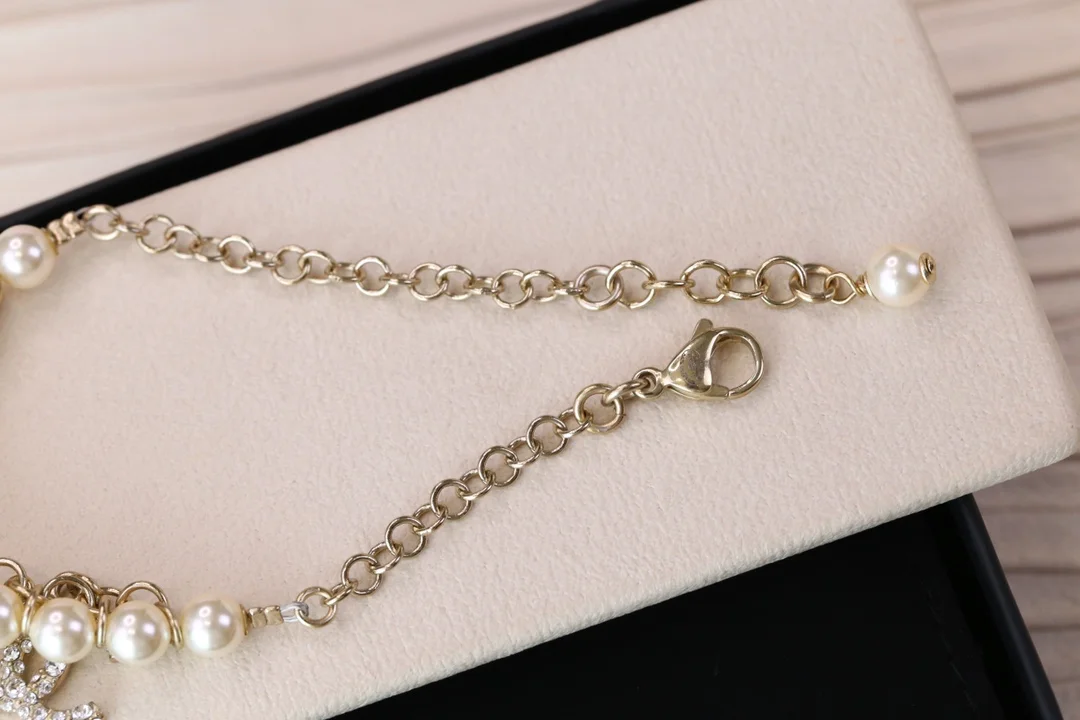 Chanel Bird CC Pearl-Effect Tassel Charm Bracelet Gold-Tone product view 9