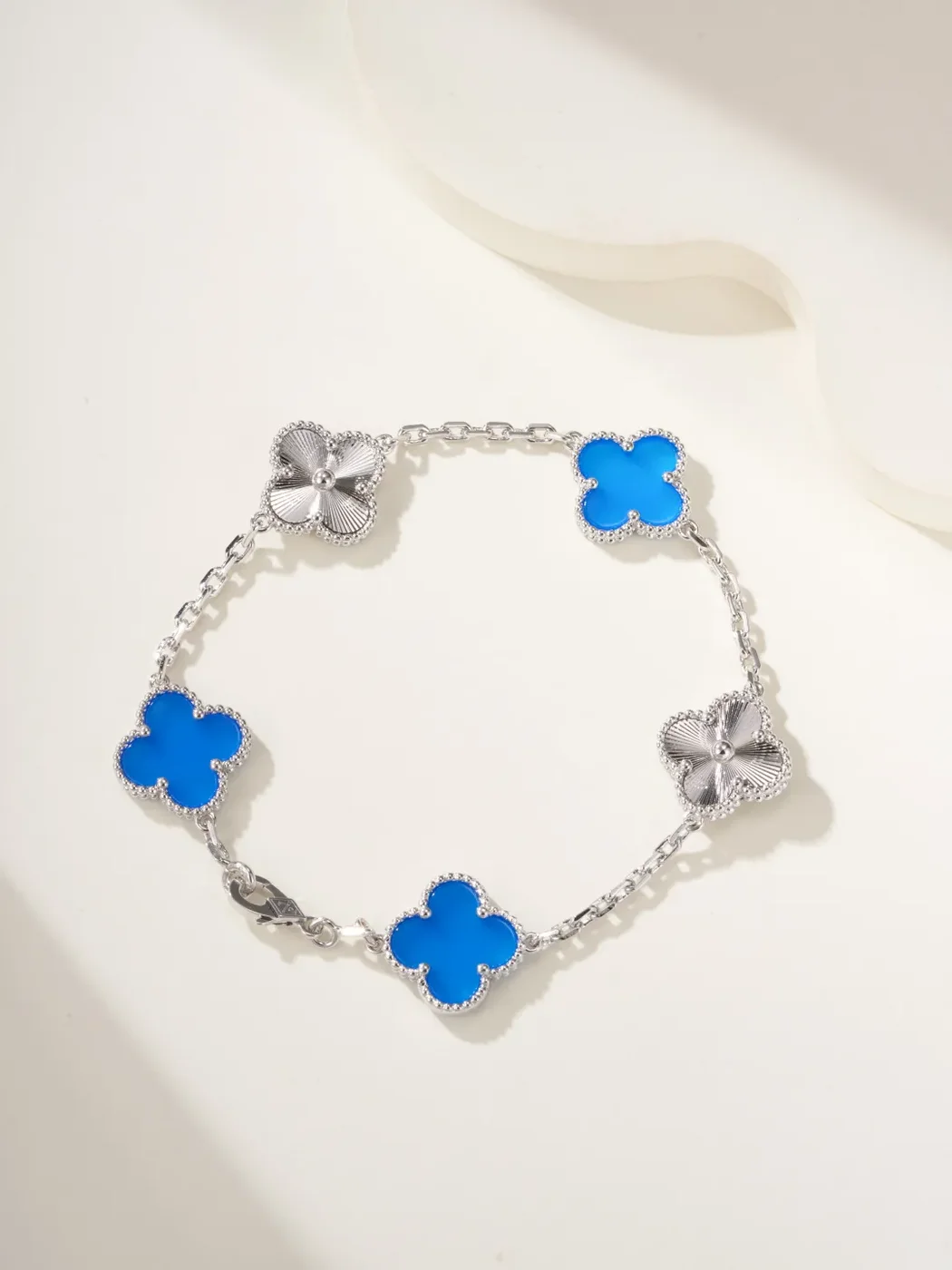 Van Cleef & Arpels Alhambra Blue Clover and Silver-Tone Knot Bracelet product view 1