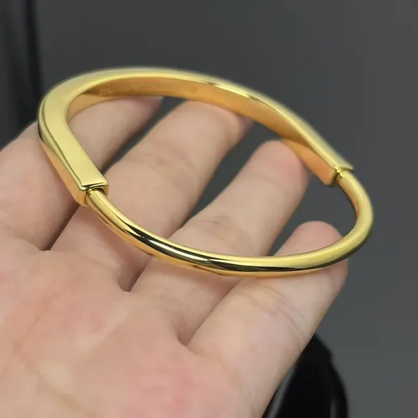 Tiffany & Co. Smooth Lock Hinged Bangle Gold-Tone product photo
