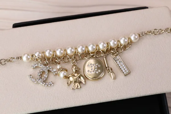 Chanel Bird CC Pearl-Effect Tassel Charm Bracelet Gold-Tone product view 6