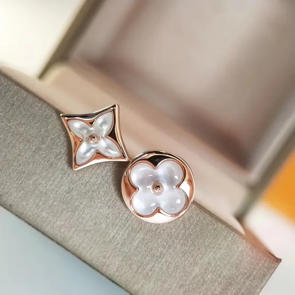 Louis Vuitton Asymmetric Star and Sun Pearlescent Stud Earrings Rose-Tone product photo